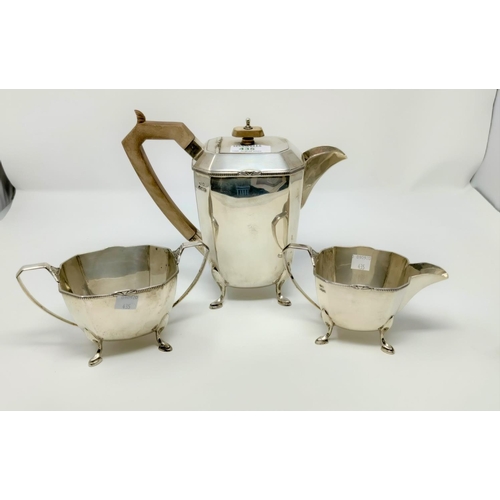 435 - An Art Deco hall marked silver coffee set of canted rectangular tapering design with beaded rim and ... 