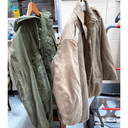 60c - A Military green jacket, single crossed rifle button to shoulder; another military jacket
No sizing ... 