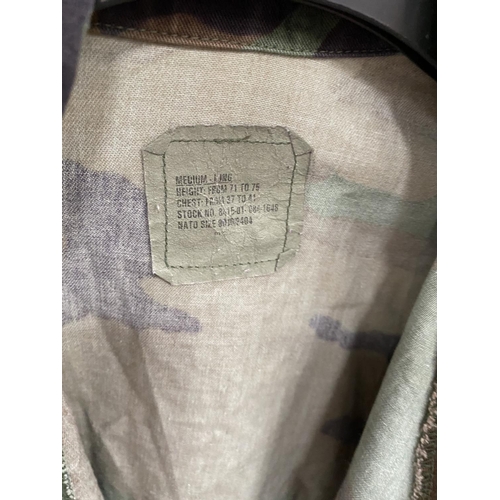 60D - A camouflage jacket and trousers and a Fossil military issue jacket
Small