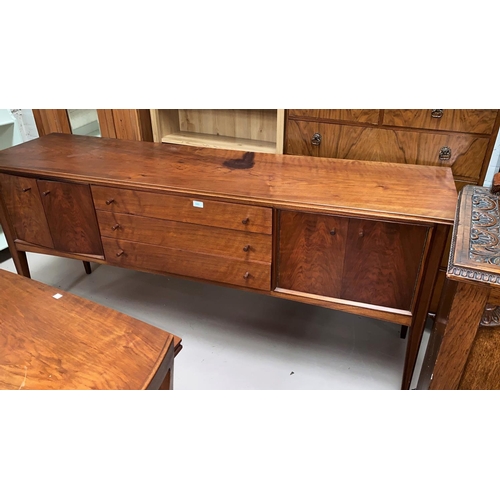 551B - A 1960's walnut / teak dining suite comprising table with extending rectangular top, 5 ladderback ch... 