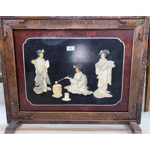 138 - A late 19th century Japanese Shibayama and lacquer fire screen depicting 3 Geishas, in carved frame,... 