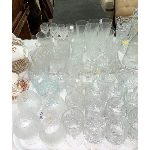 165 - A set of 12 crystal champagne flutes; other cut drinking glasses