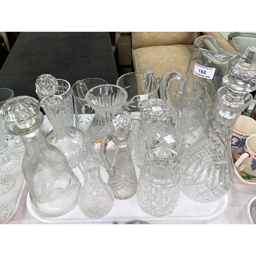 166 - A modern 2 bottle tantalus; a selection of cut glass decanters; jugs; etc.
