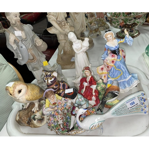 169 - A Meissen style group:  2 seated lovers; 2 Royal Doulton figures; a Royal Crown Derby cat; a Herend ... 