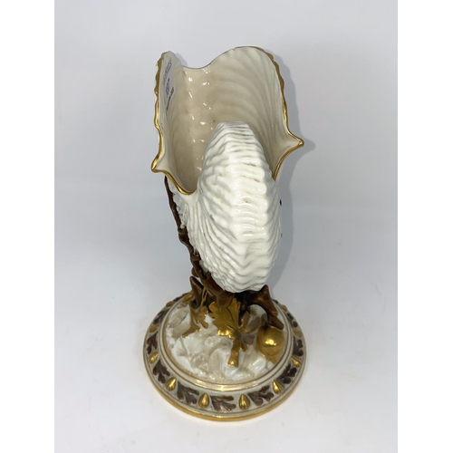 187 - A Royal Worcester nautilus shell vase in gilded naturalistic colour, on circular base, height 22