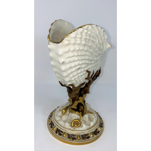187 - A Royal Worcester nautilus shell vase in gilded naturalistic colour, on circular base, height 22
