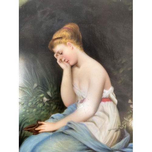 190 - A 19th century ceramic rectangular plaque depicting a young woman seated by a woodland pond, weeping... 