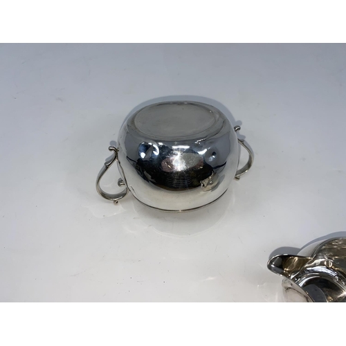 265 - A small circular silver 3 piece tea set marks worn, 12.5 oz