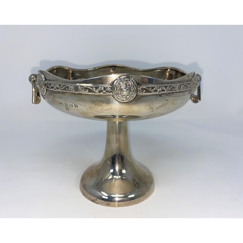 270 - A hallmarked silver shallow 2 handles dish with relief Celtic hand on inverted trumpet column by Hen... 