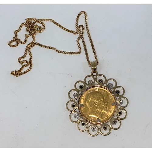 275 - A 1905 sovereign in 9 carat hallmarked gold jewelled clip pendant set diamonds and sapphires, 13 gm,... 