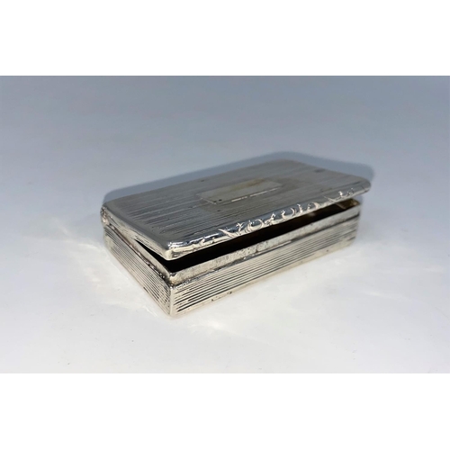 284 - A rectangular silver Georgian snuff box with engine turned ribbed decoration and embossed border (no... 