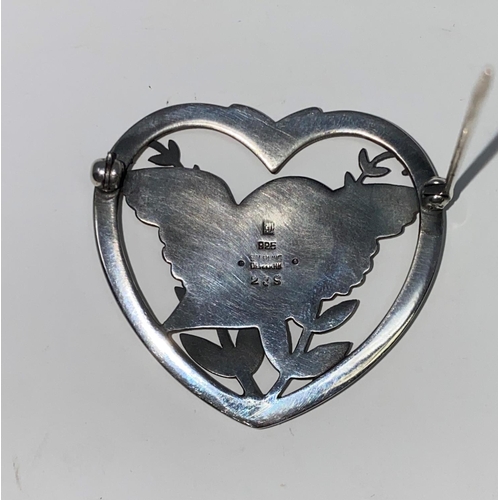 291 - A Georg Jensen Danish silver heart shaped brooch with bird sitting on fronds with outstretched wings... 