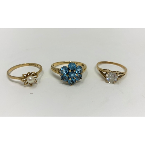 296 - Two 9 carat hallmarked gold gem set dress rings; a similar ring stamped '9c', 5.2 gm gross