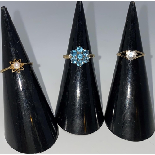 296 - Two 9 carat hallmarked gold gem set dress rings; a similar ring stamped '9c', 5.2 gm gross