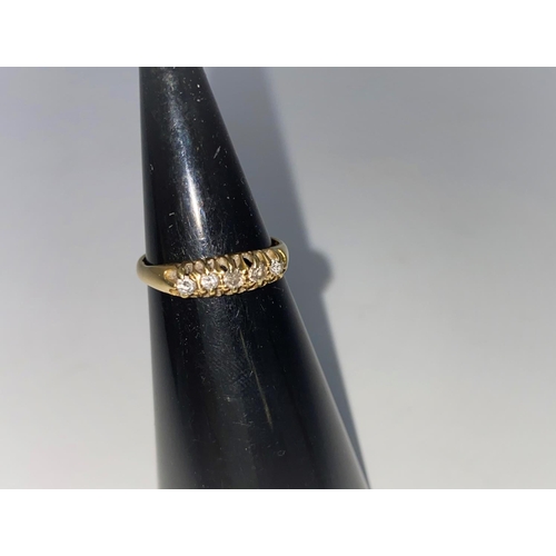313c - A gypsy style ring set 5 diamonds in 18 carat gold setting, 2.6gm