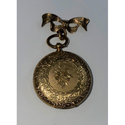 335 - An Edwardian fob watch in chased yellow metal case, open faced and key wound, stamped '18K', on 9 ca... 