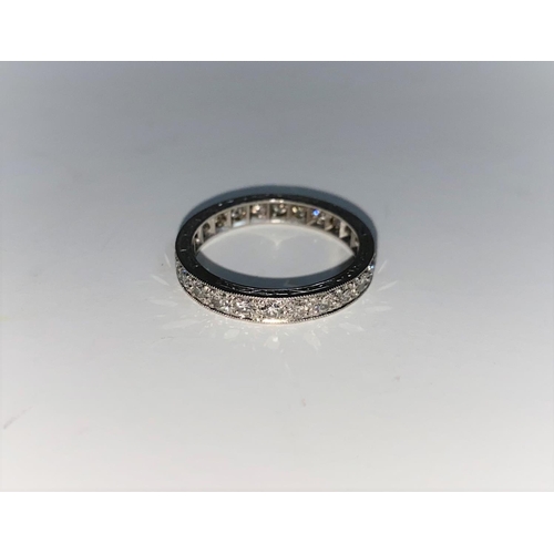 360 - A white metal diamond set eternity ring, unmarked, tests as 18 ct, 3.8 gm