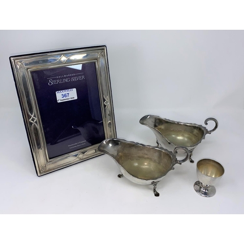 367 - A hallmarked silver photo frame, Sheffield 1991; 2 silver plated sauce boats, egg cup etc
