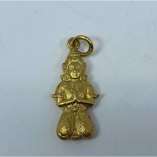 373 - A yellow metal Buddha pendant stamped 18K, 2.4gm
