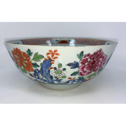 53 - An 18th century Chinese punch bowl with polychrome decoration of flowers, diameter 24cm (minor chipp... 