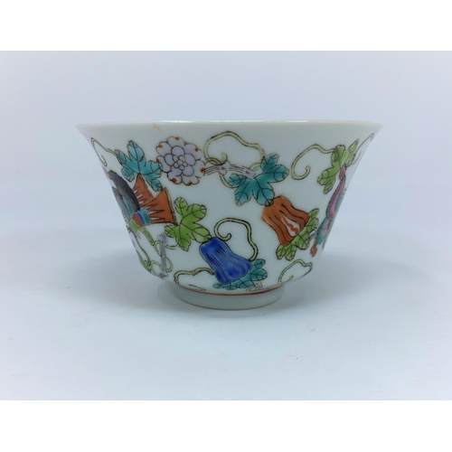 61 - A late 19th / early 20th century Kangxi style shallow dish decorated in polychrome with central pane... 
