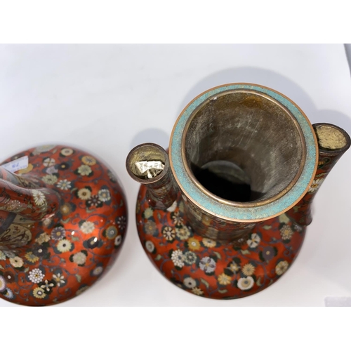 75 - A late 19th/early 20th century Japanese pair of cloisonné vases of compressed onion form with tall s... 