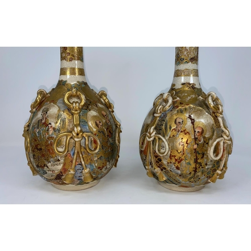 77 - A pair of satsuma vases with ovoid bodies and slender necks, relief ropework decoration, the reserve... 