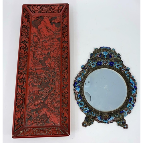 95 - A cloisonne framed Chinese mirror decorated with sea horses etc and a cinnabar coloured tray
