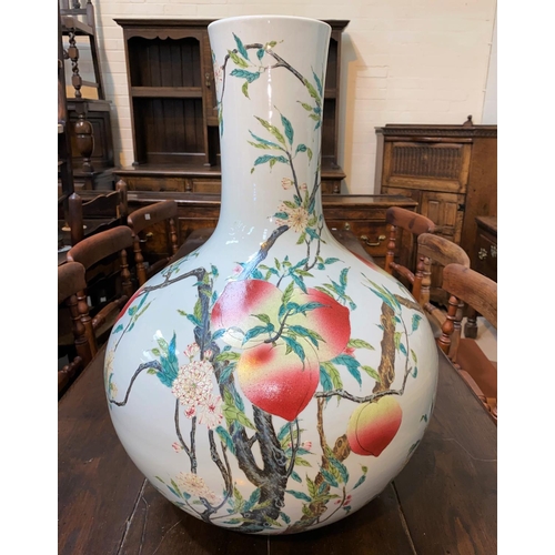 93 - A very large Chinese porcelain bottle vase decorated in polychrome with peaches on branches, with ch... 