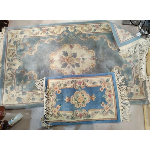 13a - A blue ground floral Chinese rug and another smaller rug