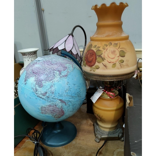 17 - A modern terrestrial globe; a peach lamp