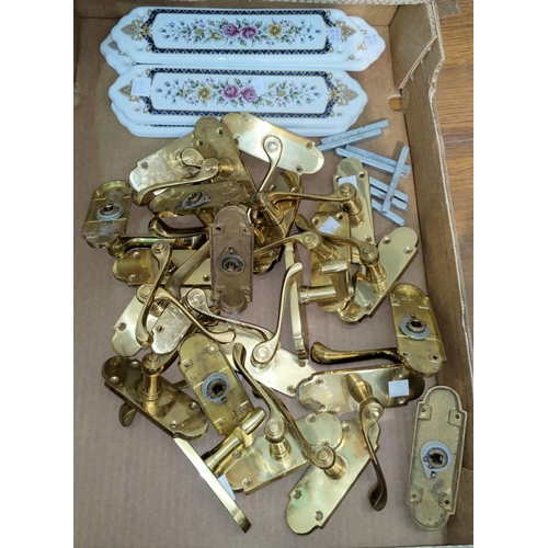 27 - A selection of brass door handles; 5 ceramic finger plates