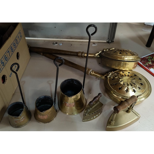 48 - Three graduating vintage brass cider measures, vintage brass irons and two brass bed pans