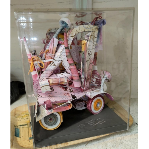 493 - An unusual paper sculpture of a fanciful car by Paul Johnson, height 26 cm, in perspex case