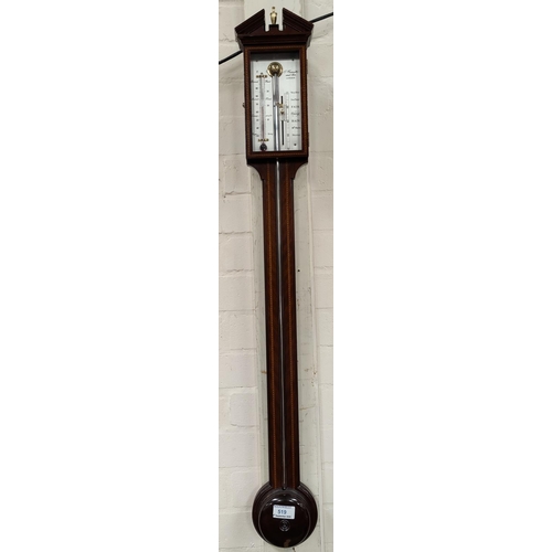 519 - A reproduction mahogany stick barometer with inlaid decoration by A Comitti & Sons London