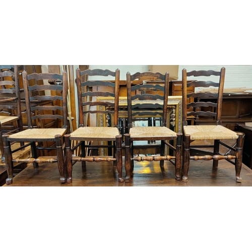 534 - A near matching set of 8 (6+2) 19th Century countrymade elm ladder back dining chairs with rush seat... 
