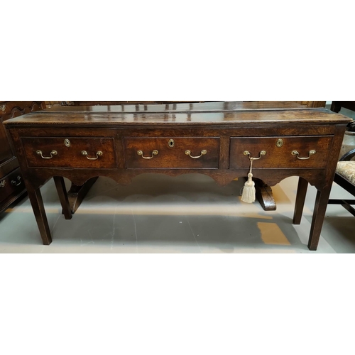 535 - A mid 18th Century countrymade oak dresser base with 3 frieze drawers with brass swan neck handles a... 