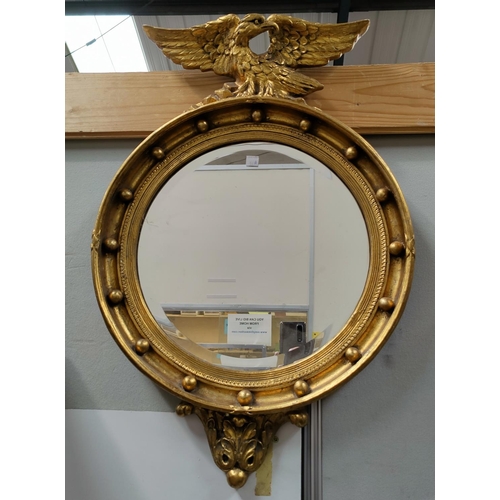 537a - A late 19th century bevelled edge wall mirror in gilt halo frame with eagle finial