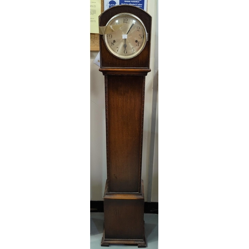 542 - A 1930's bentwood office armchair; a beaded oak 1930's oak chiming granddaughter clock
