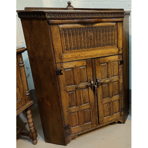 547A - Reproduction Jacobean style oak floor standing corner cupboard , fall front over two panelled doors
