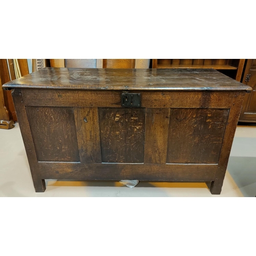548 - 18th century framed and panelled oak blanket box with hinged lid and block feet 133 cm