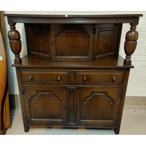 551C - A reproduction oak court cupboard with single cupboard over 2 drawers and 2 cupboards