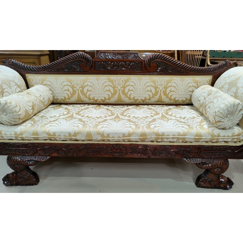 554 - A reproduction William IV style mahogany scroll arm settee/chaise longue with detailed carved decora... 