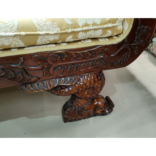 554 - A reproduction William IV style mahogany scroll arm settee/chaise longue with detailed carved decora... 