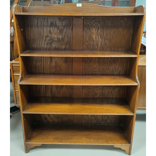 561 - An early 20th century stained ash 4 height church bookcase with hinged top shelf, PAT. APL, 92cm