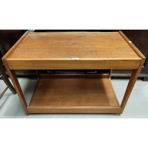 571 - A 1960's teak 2 tier tea trolley; a mahogany occasional table with oval top and Sheraton style inlay