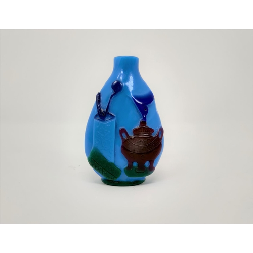 111 - A Chinese cameo glass blue snuff bottle decorated with vases, pots etc