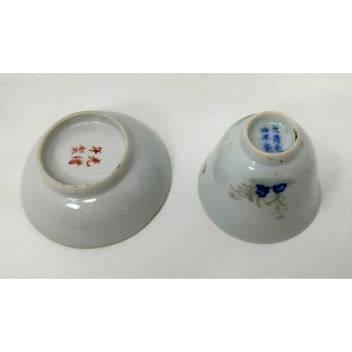 121 - A Chinese tea cup decorated with flowers, 6 character mark to base and similar saucer decorated with... 