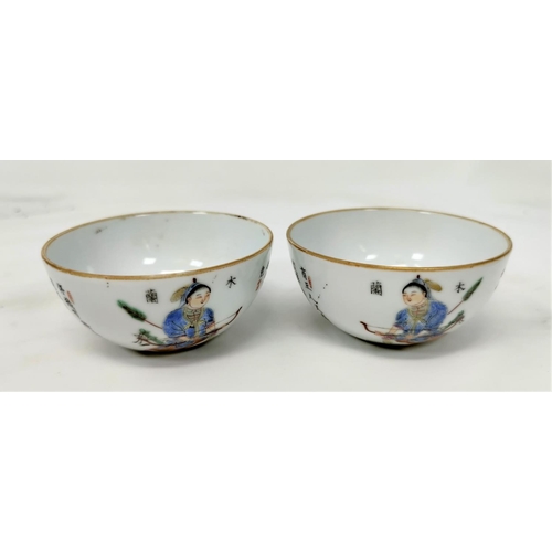 124 - A pair of Chinese tea bowls both depicting a warrior archer figure to one side and Chinese character... 