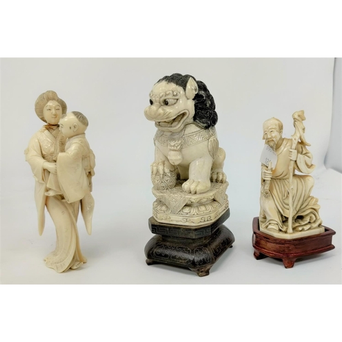 126 - Three late 19th / early 20th century carved ivory Japanese figures, woman with baby, seated old man ... 